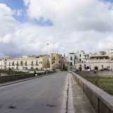 Per raggiungere la citt� percorriamo la strada provinciale 231 e imbocchiamo la prima uscita che porta nel centro abitato, ritrovandoci cos� in via Modugno. L'arteria dopo un chilometro cambia nome in via Ferdinando II di Borbone